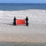 China and Philippines unfurl competing flags on disputed South China Sea sandbars, reviving tensions