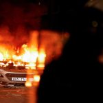 Masked rioters in Northern Ireland attack police, torch houses for second night